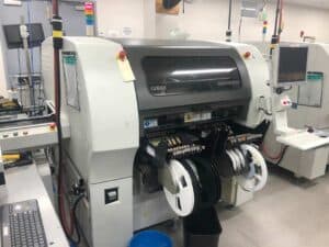 Front facing photo of a 2005 Universal Genesis GI-14D smt pick and place machine we have for sale.