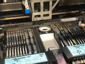 Close up photo of a 2005 Universal Genesis GI-14D smt pick and place machine.